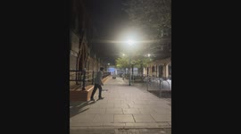 man attempts to jump over railing and lands on his nuts, night time, corona, beer