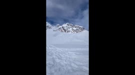 skier hits triple backflip to flat, lands on his back in powder