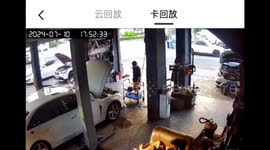China: Fire Extinguished on Vehicle Hood at Repair Shop