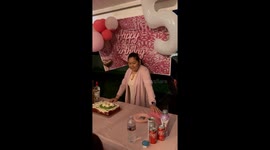 Mother-in-law's birthday celebration ends with an enthusiastic cake push