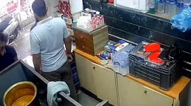 Quick-thinking pedestrians leap away from collapsing building in India