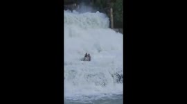 Bystanders rescue two men stuck on waterfall in India