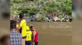 Four stranded in rising river rescued by emergency team in northern India