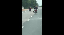 Reckless motorcycle rider swerves to avoid bull wandering across road