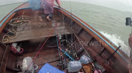 Passing fishermen rescue woman floating at sea during storm off Thai coast
