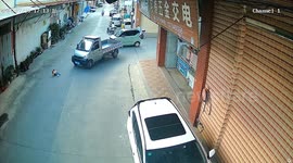 Truck driver brakes just in time to save child falling from moving car