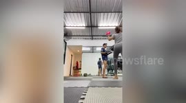 Woman accidentally kicks Muay Thai trainer