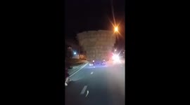 Truck overloaded with hay stuns passing drivers