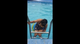 Mother topples backwards from her inflatable ring