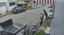 Motorcycle topples backwards as rider loads it into truck