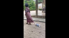 Dog hilariously drags itself along by biting person's cloth