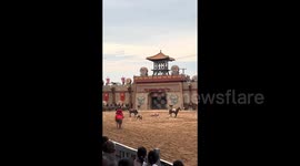 Shocking moment actors thrown from horses during performance in central China