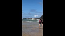 Strong waves steal Mr. Whippy's ice cream truck at Harlyn Bay