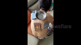 Chinese women share bizarre new trend of husbands' sweaty backs sticking to objects in the summer heat