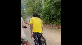 Child falls into ditch after losing control of bicycle in Thailand