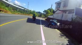 Tyre falling off truck, strikes oncoming vehicle before landing in roadside field in China