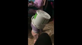 Little girl’s fun with basket hat ends in tumble and quick recovery