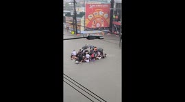 Locals float on raft through neck-deep floods from Typhoon Gaemi