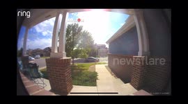 Paper bag bursts open and scatters groceries at the door