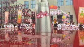 Hungry Chinese locals tuck into world's largest hot pot