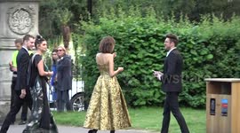 Alexa Chung and Pixie Geldof who meets a dog at the British Vogue Centenary Gala Dinner