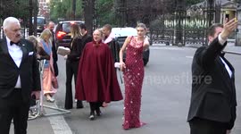 Model Lily Donaldson has trouble getting up stairs in long dress at British Vogue 100 Gala Dinner