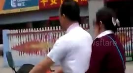Blind man rides motorbike on road