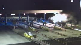 Lorry on fire drives through toll booth