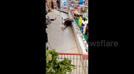 Disgusting scene as Chinese man lies on supermarket floor with bare foot on drinks cooler