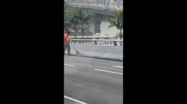 Road sweeper in Kuala Lumpur, Malaysia, rescues kitten and continues work