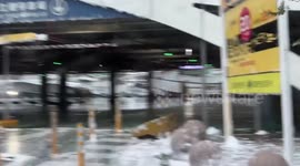 Foam bubbles cover street during typhoon in Taiwan
