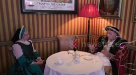 Horrible Histories Terrible Tudors star Neal Foster in character compares a painting of Henry VIII to himself.