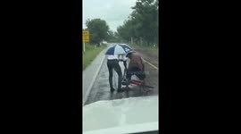 Kind driver helps pensioner who fell off bike in rain