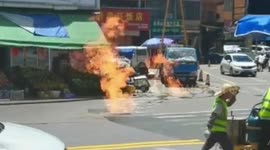 Underground gas pipeline leak ignites fire erupting from sewers