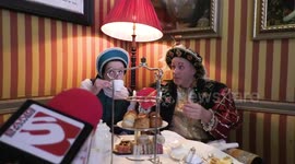 Horrible Histories Terrible Tudors stars Neal Foster and Emma Swan in character drink tea.