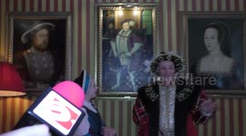 Horrible Histories Terrible Tudors stars Neal Foster and Emma Swan in character look at an Edward painting.