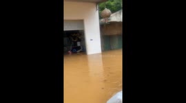 Man builds raft from wood and plastic bottles to rescue people and goats from floodwaters