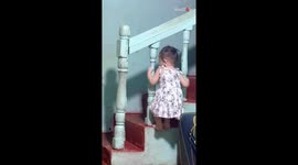 Little girl's joyful escapades around the home