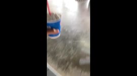 Young girl's blizzard ice cream falls after a silly upside-down trick