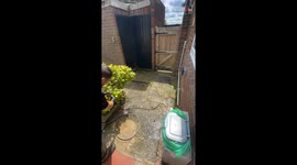Satisfying process of pressure washing a filthy green-stained patio