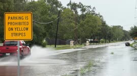 Vehicles Maneuver Through Flooded Streets in Dickinson, Texas on Hughes Rd after Heavy Rains