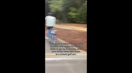 Kids beg for tandem bike and then refuse to ride it, dad rides it solo in the rain while they drive next to him in a covered golf cart