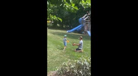 Big sister gets hits by little brother with a metal bat