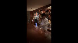 Tokyo bartender creates blue flame display before serving