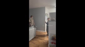 Stepfather’s slippery fall during water play delights playful son