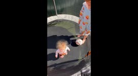 Baby on trampoline with static hair