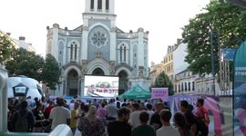 Spectators celebrate Paris Olympics opening ceremony in Saint-Etienne