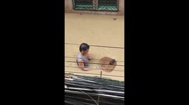Man saves rat during typhoon Gaemi flood in Pasig, Metro Manila
