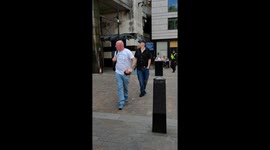 A far-right member shouts an excuse for the racist police during the rally against fascist Tommy Robinson' in London, UK