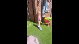 Sweet mix-up: Little girl wears kitchen mitts thinking they are shoes